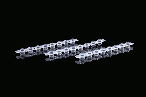Clear domed 8-strip PCR tube caps made of polypropylene, shown at an angle.
