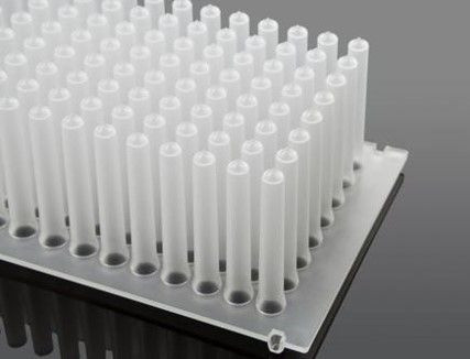 Angled view of a sterile NEST 96-well translucent plastic tip comb for magnetic applications.