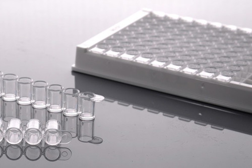 NEST 96-well ELISA plate with detachable clear 8-well strips and white frame on reflective surface.