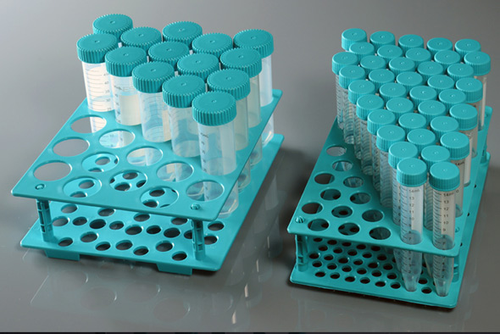 Two turquoise plastic racks filled with various sizes of centrifuge tubes with matching caps.