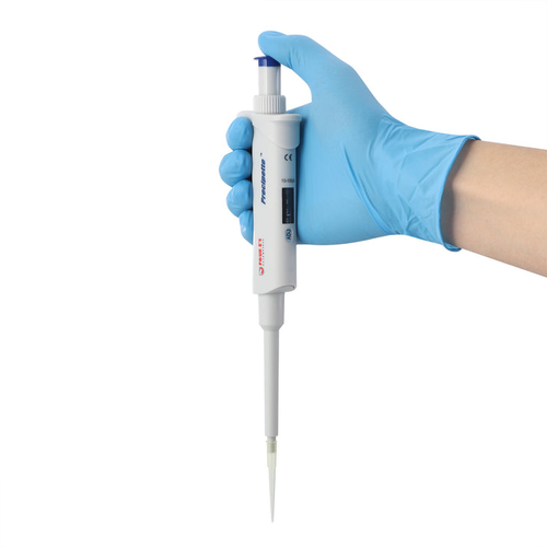 A hand in a blue glove holds a grey 4E's single-channel adjustable pipette with a tip attached.