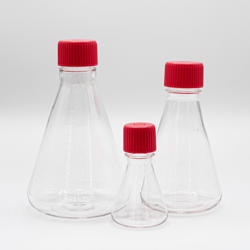 Three clear plastic Erlenmeyer flasks with red screw caps in varying sizes on a white background.