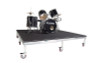 Top rated Quik Stage 6' x 8' High Rolling Drum Riser Package with Black Polyvinyl Surface - Angled view with drum set