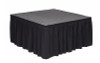Top rated 32" High Black Shirred Pleat Wyndham Flame Retardant Polyester Stage Skirting with the Loop Side Fastener.  - Attached to a square stage.