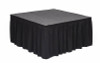 Top rated 16" High Black Expo Pleat Poly Premier Flame Retardant Polyester Stage Skirting with the Loop Side Fastener.  - Attached to a square stage.