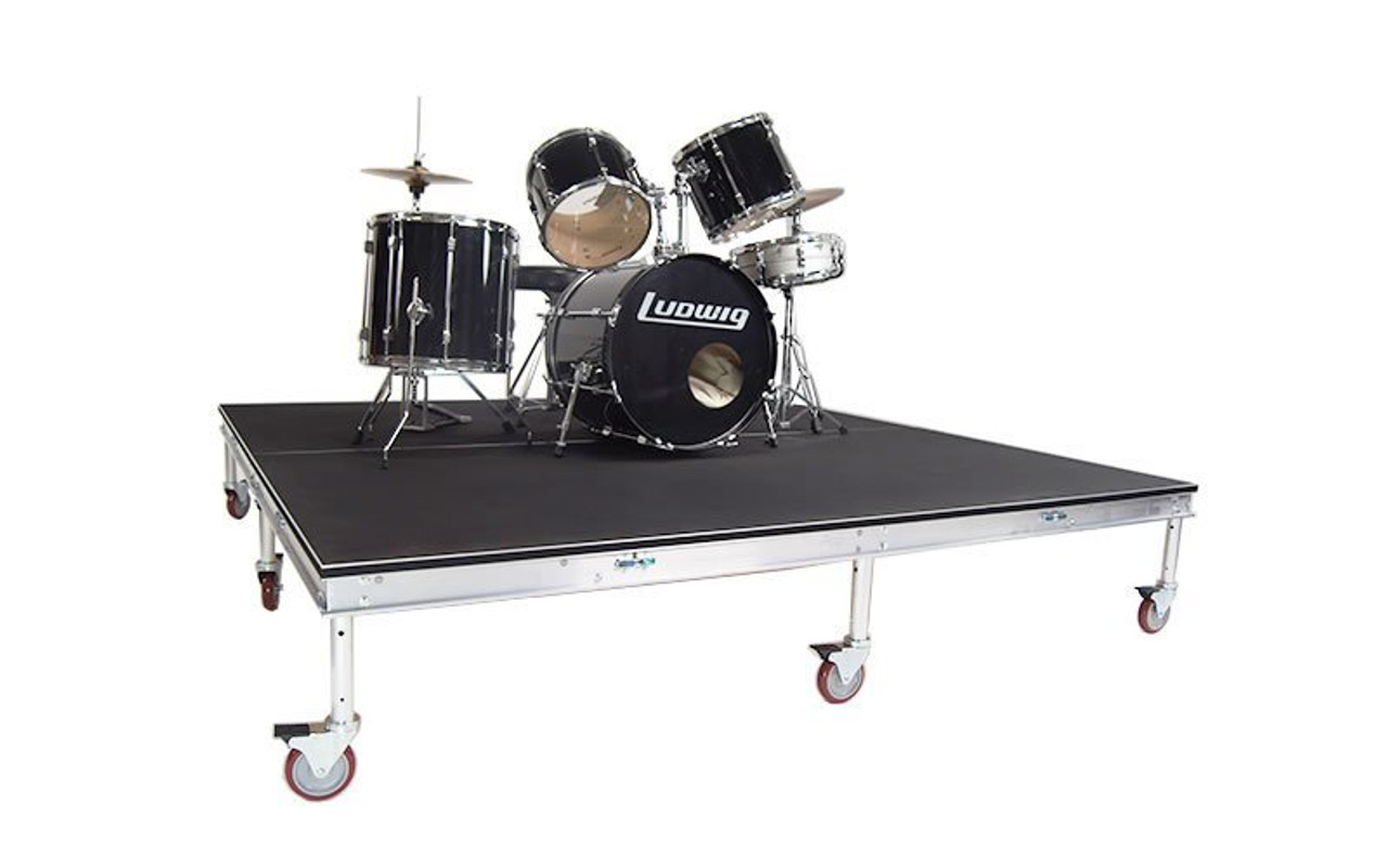 Top rated Quik Stage 6' x 8' High Rolling Drum Riser Package with Black Polyvinyl Surface - Angled view with drum set