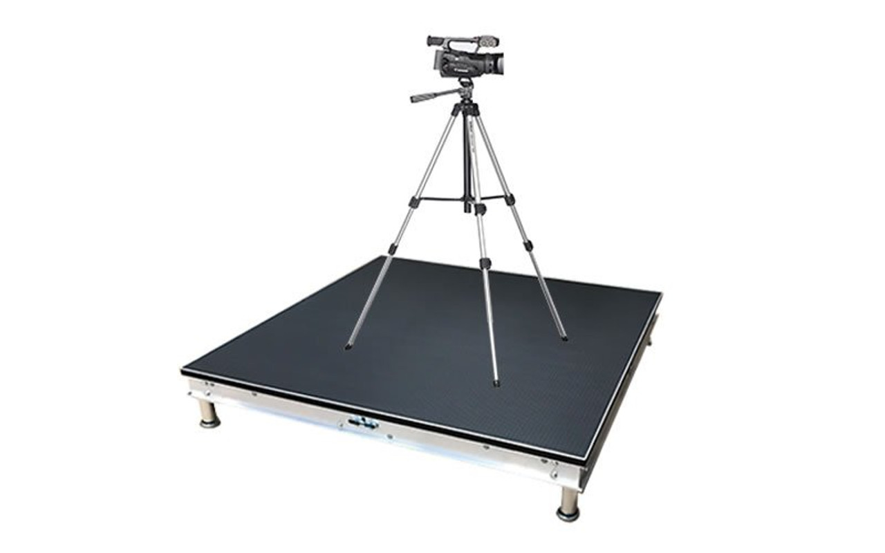 Quik Stage 4' x 4' x 8" high professional quality camera platform riser with black polyvinyl non-skid deck surface- Front Angle with a Camera