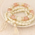 Golden Four-leaf Clover and Tassel Pendants Multi-layer Beads Fashion Bracelet - White