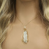 Fulgurite lightning sand jewelry on a tan model with ombre blonde hair [78591].