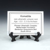Komatiite Pioneer complex description tag on a plastic tag stand, Sciencemall-USA Komatiite Pioneer complex description tag on a plastic tag stand, Sciencemall-USA