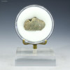Green trinitite, Specimen ID:78997 facing front on a display stand, Sciencemall-USA