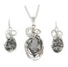 Meteorite jewelry set with earring and necklace, shown with chain.