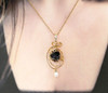 Titanic coal necklace wire wrapped in 14k gold on a chain with a pearl, on a model, Sciencemall-USA Titanic coal necklace wire wrapped in 14k gold on a chain with a pearl, on a model, Sciencemall-USA