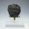 Manganese nodule 48.7 grams, facing front on a plexiglass riser, at Sciencemall-USA