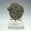 Complete 119 g front-facing polymetallic manganese nodule from the Clarion-Clipperton Zone on a display stand, at Sciencemall-USA