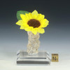 Fulgurite lightning sand vase with fabric yellow sunflower with leaf on acrylic display base and sizing cube.