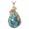 Paua shell jewelry hand wire wrapped in 14k gold on a chain, from New Zealand.