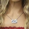 Come fly with me Pegasus horse pendant sterling silver with chain, shown on a model with curly ombre hair and camisole.