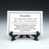 Komatiite Barberton Greenstone Belt description tag on a black stand, Sciencemall-USA