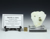 Helvine called Helvite shown with description tag on a stand, sizing cube and specimen on a plexiglass riser.