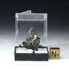 Platinum ore shown back with sizing cube. This Platinum ore is from the Merensky Reef, Bushveld complex South Africa.