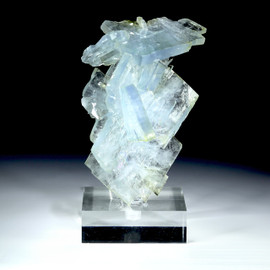 Large blue barite stacked crystals with quartz and pyrite shown on a square plexiglass riser, from the Jordi Fabre mineral collection.