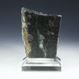 Nuvvuagittuq faux amphibolite 28817 shown front on a plexiglass riser facing front.