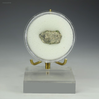 Front-facing Trinitite 1.5 grams, green and black on a display stand, for sale at Sciencemall-USA