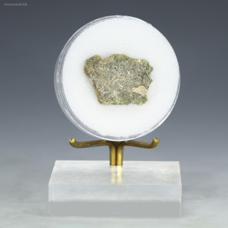 Green trinitite with inclusions, Specimen ID84592 facing front on a display stand, Sciencemall-USA