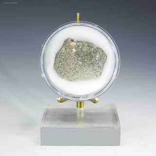 Large trinitite green black 5.9 grams in a disk on a display stand facing front, for sale at Sciencemall-USA Large trinitite green black 5.9 grams in a disk on a display stand facing front, for sale at Sciencemall-USA