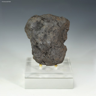 Complete 78 g polymetallic manganese nodule from the Clarion-Clipperton Zone on a display stand, front facing, at Sciencemall-USA Complete 78 g polymetallic manganese nodule from the Clarion-Clipperton Zone on a display stand, front facing, at Sciencemall-USA