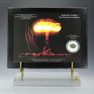 Authentic Trinitite atomic glass 0.98 g Riker Display, green minor black displayed with sizing cube, for sale at Sciencemall-USA