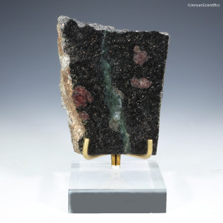 Nuvvuagittuq garnet paragneiss 28817 shown front on a plexiglass riser facing front, at Sciencemall-USA.