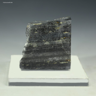 Front-facing 49 gram Isua Banded Iron, Greenland, on a riser for sale at Sciencemall-USA