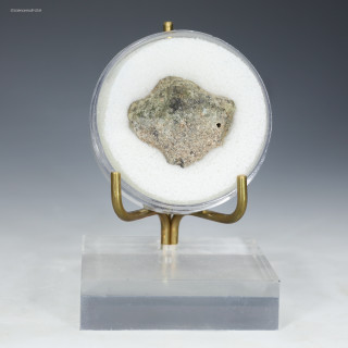 Trinitite specimen 29885 front view, green, black, metal on display stand, for sale at Sciencemall-USA