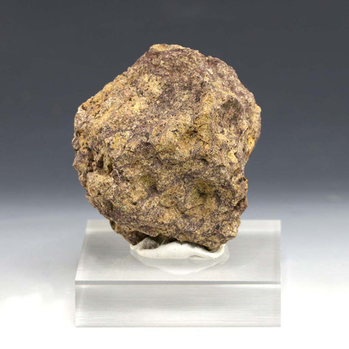 Vista Alegre meteorite impact breccia from Brazil on display stand.