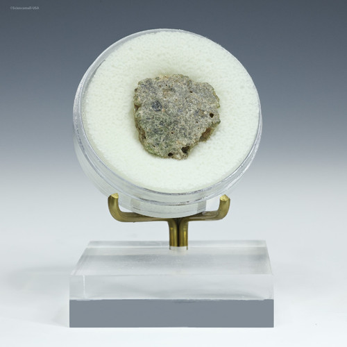 Green with black trinitite, Specimen ID:56885 facing front on a display stand, Sciencemall-USA