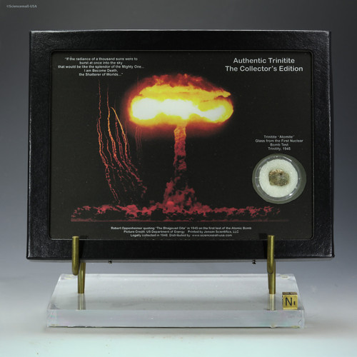 Trinitite 0.5 g Riker display atomic glass collectible on a riser, for sale at Sciencemall-USA