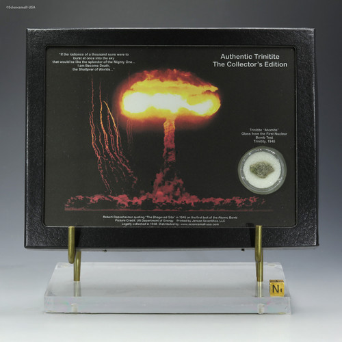 Green Trinitite collectible Oppenheimer quote display, 0.8 g, shown on a plexiglass base with sizing cube, for sale at Sciencemall-USA