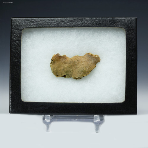 Trinitite specimen ID: 85787, facing front on a display stand, Sciencemall-USA