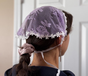 Graceful Lilac Verona: Mother's Embrace veil with ties has a delicate daisy trim. The gorgeous, light purple lace features roses and daisies. A perfect color for any little girl.