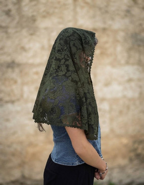 Our "Blessed Olive" St. Olivia veil is stunning from the side as seen on our model. Her dense botanical lace flows beautifully across the shoulders.