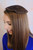 This small circle starter in brown is understated and blends perfectly with darker hair colors.