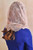 Back view of a woman wearing the Blush infinity veil, displaying how the sheer lace falls elegantly across her shoulders and back.