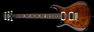 Left-handed PRS SE Custom 24 in Black Gold Sunburst, full front view with flame maple top and cream pickup rings