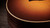 Close detail of the matte sunburst top edge, binding and spruce grain