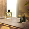 Miller Harris Tea Tonique Eau de Parfum  placed on wooden surface