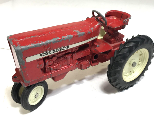 RESALE SHOP - Inernational red tractor. With pull trailer