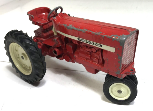 RESALE SHOP - Inernational red tractor. With pull trailer