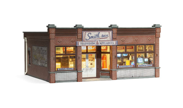 OakridgeStores.com | Woodland Scenics - Smith Brothers TV & Appliance Store - Prebuilt O Scale Building with Lights (BR5873) 724771058731